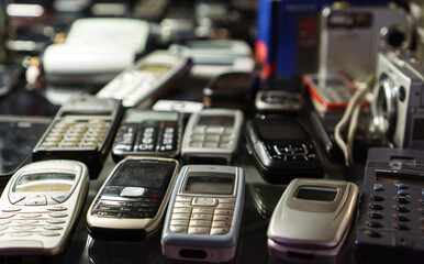 Collection of old retro mobile telephones.