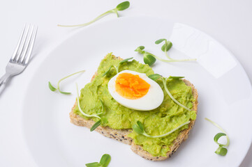 Bread with avocado , vegetables fruit and egg on white background , Healthy breakfast concept