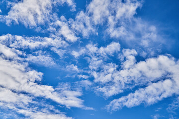 Naklejka na ściany i meble Beatiful blue sky with clouds on a sunny day