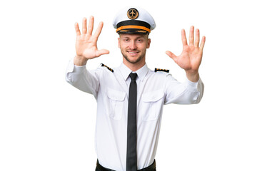 Airplane pilot man over isolated background counting ten with fingers