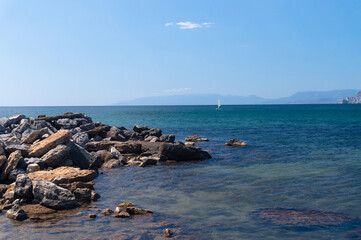 windsurfer in calm sea. sea and mountains in summer in sunny weather. Crimea, Sudak