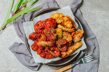 yangnyeom chicken, Korean Seasoned Fried Chicken : This dish is seasoned chicken cut into pieces, deep- fried, and mixed with soy sauce, gochujang, or other sauces. It has a mild yet spicy taste that 