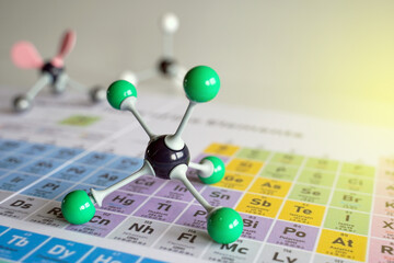Simulate Shape of covalent molecules on a periodic table background. Soft and selective focus.     ...