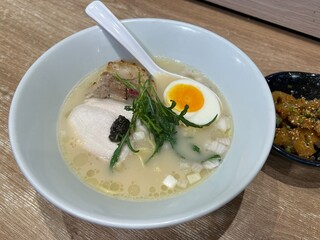 Black Truffle Ramen,combination of black truffle and pork chintan soup, served with crafted fresh thin noodles, silky chicken chashu, torched pork-belly chashu, egg, wild rocket, and red onion