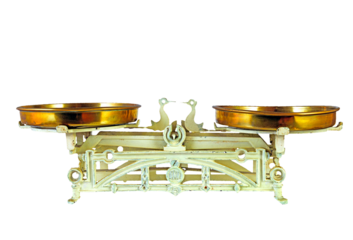 Ancient kitchen scale and garlic - old rustic balance on white background