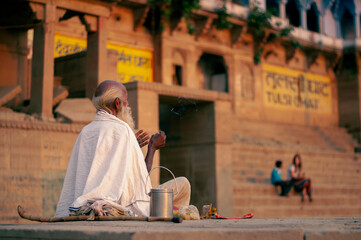 Priest praying in ganga