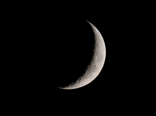 View of the crescent moon through telescope.