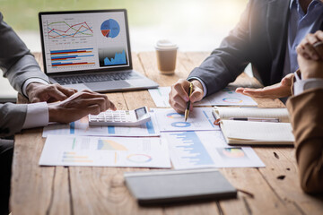 Financial Business meeting analyze tax graph calculator company's performance to create profits and growth, Market research reports and income statistics, Financial and Accounting concept.	