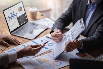 Financial Business meeting analyze tax graph calculator company's performance to create profits and growth, Market research reports and income statistics, Financial and Accounting concept.	