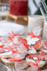 Red fresh cookies with cartoon characters for the party.