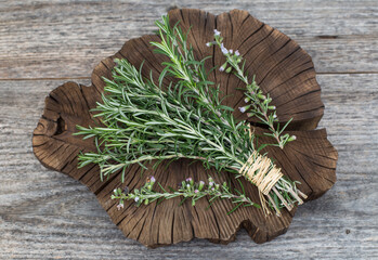 Fresh green rosemary on the wooden table