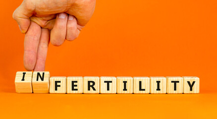 Fertility or infertility symbol. Concept words Fertility or Infertility on wooden cubes. Doctor...