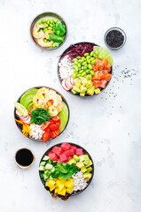 Hawaiian poke bowl set: tuna, salmon, shrimp with avocado, mango, radish, rice and other...