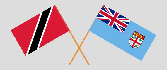 Obraz premium Crossed flags of Trinidad and Tobago and Fiji. Official colors. Correct proportion