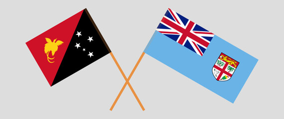 Crossed flags of Papua New Guinea and Fiji. Official colors. Correct proportion