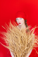 Beautiful Fashion art portrait of young sexy blonde woman with wheat. Organic cosmetic products for healthy hair concept