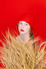 Beautiful Fashion art portrait of young sexy blonde woman with wheat. Organic cosmetic products for healthy hair concept
