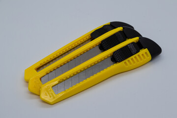 Yellow work knife with white background