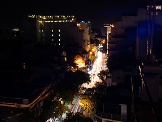 Aerial shot of the buildings of Hanoi with illuminated windows in Vietnam