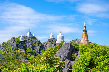 Wat Praputthabaht Sudthawat pu pha daeng, Wat Chaloem Phra Kiat Phrachomklao Rachanusorn. There is a pagoda built on a high rocky mountain by belief and faith. Unseen Thailand, Lampang, Thailand.