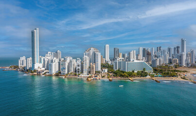 Fototapeta na wymiar The modern skyscrapers in the Cartagena in Colombia aerial panorama sky clouds view