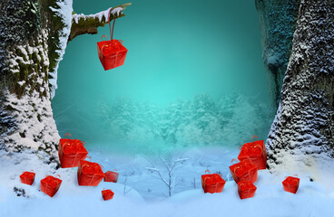 Winter gift boxes. Winter holidays concept, ideas for red gift boxes on the snow and hanging on snowy tree branch