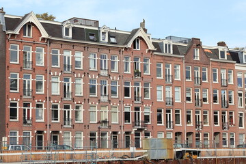 Obraz premium Amsterdam Jacob Catskade Street View with Brick House Facades, Netherlands
