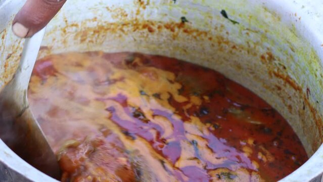 Indian catering services and spicy delicious food. Desi mutton curry making on WOOD STOVE (Desi chulha) mutton curry. Preparing mutton curry or spicy mutton gravy in pure Indian style