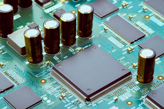 high-tech electronic parts and microprocessors on the board close-up, soft focus
