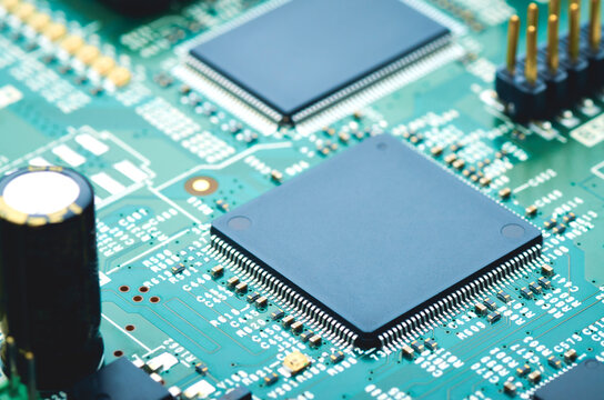 electronic board with microchips and electronic components close-up, soft focus