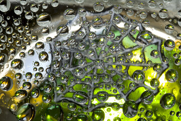 Space abstraction. Striped spheres are located against the gold-green background with gray web silhouette. 3D render. 