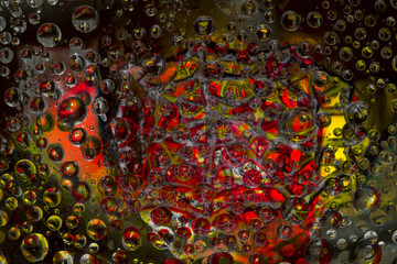 Striped spheres are located against the red-yellow background with yellow-gray web silhouette. Space abstraction. 3D render. 