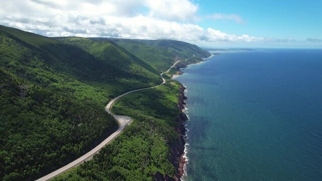 Winding cliffside road above the ocean