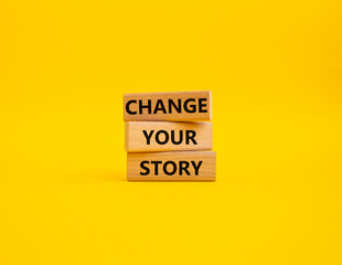 Change your story symbol. Concept word Change your story on wooden blocks. Beautiful yellow background. Business and Change your story concept. Copy space