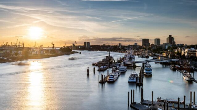 Hamburg, Germany: sunset in the harbor of Hamburg. Aerial view of Hamburg port. The Port of Hamburg is a sea port on the river Elbe