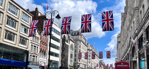 Low angle view of UK flags across The Strand, London, England, UK