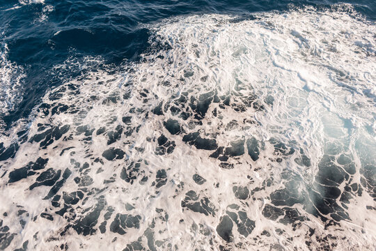 Beautiful Blue Sea With Waves And White Texture, View From Above