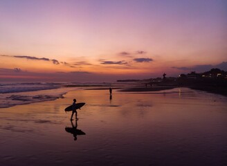 Fototapeta premium Silhouette of a people on the beach at sunset in Canggu, Bali Indonesia