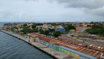 Fototapeta na wymiar Willemstad, Curacao - 04.28.2021 View of colorful colonial buildings in the old historical port of the town little Rotterdam