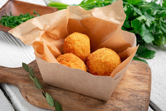 Two Potato Balls Are Partially Eaten With Cheese In The Middle Background, Croquette On White Background, Hd Photography Photo Background Image And Wallpaper for Free Download