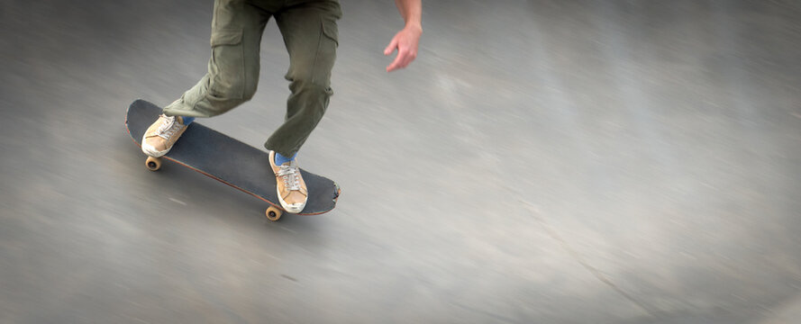 Close-Up of a boy riding a skateboard on a halfpipe in a skatepark, Venice Beach, California, USA