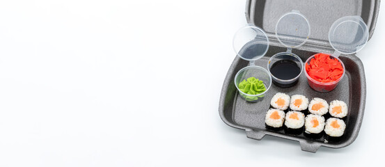 Salmon maki sushi in delivery box on white background © Collab Media