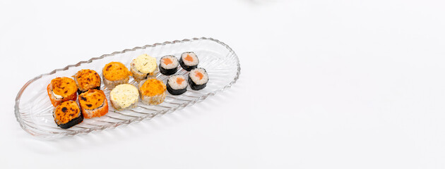 Copyspace set of sushi and rolls on glass plate