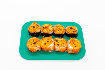 Salmon maki sushi on cutting board on white background