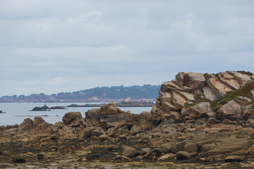 Rock formations at the french coast seen from the island of Callot with small rocky islands in the background, Carantec, Brittany, France