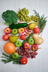 Set of fresh vegetables and fruits on a light background. Vegetables close-up. Natural fresh organic vegetables. Healthy food, raw food diet. Vegetarian life. Proper nutrition. Ready to eat
