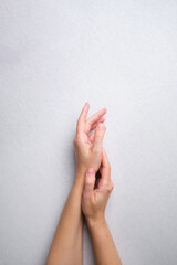 Beautiful female hands on a light background. Aesthetics of minimalism. The concept of spa, wedding salons, hand treatments