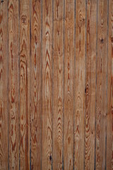 Fototapeta premium Fondo con detalle y textura de varias lamas de madera en tonos marrones, con vetas y nudos