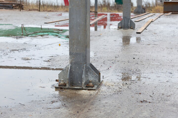 Metal structures on the construction of a house.Fastening of metal structures to the foundation.