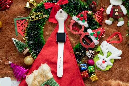 Blank Black Screen Smartwatch Mockup Image With Christmas Themed Decorations